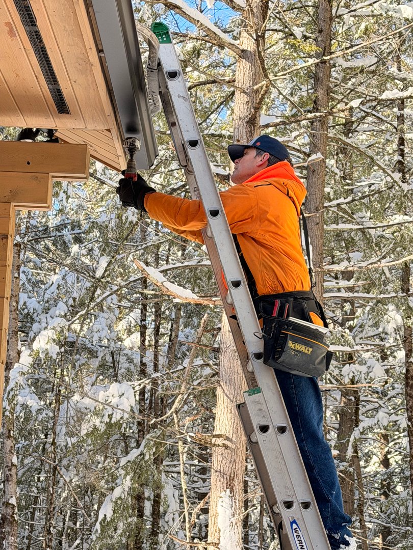 Crown Hill crew installing heat tape in winter conditions